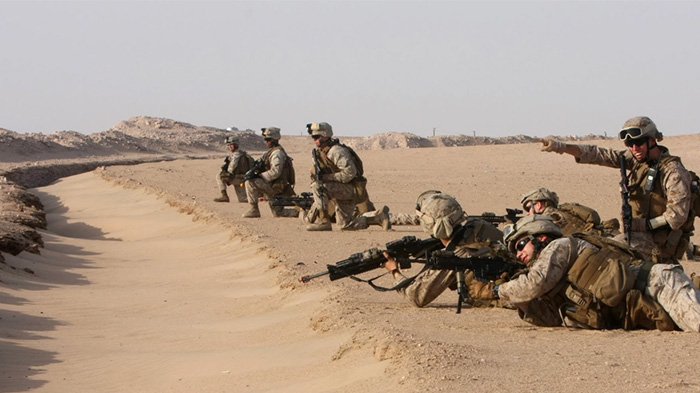 Service members in the desert.