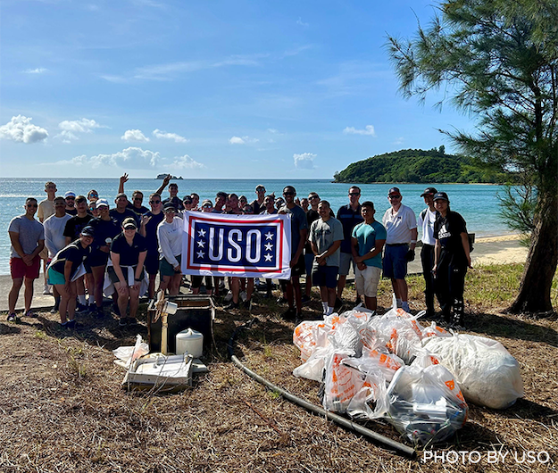 USO community cleaning the beach in Okinawa