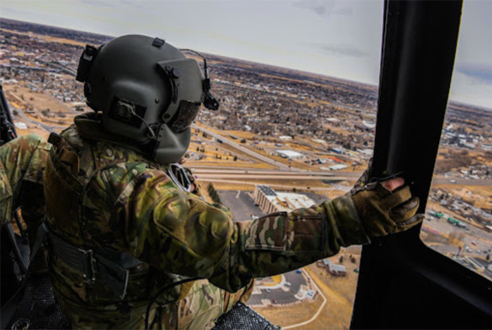 Service member preparing to jump out of a plane