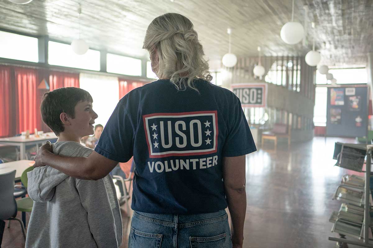 Liam with a USO volunteer