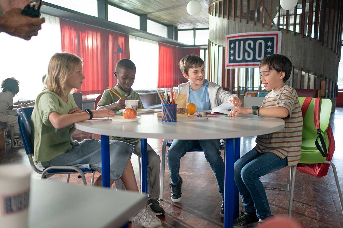 Liam doing activities with other military kids at a USO center