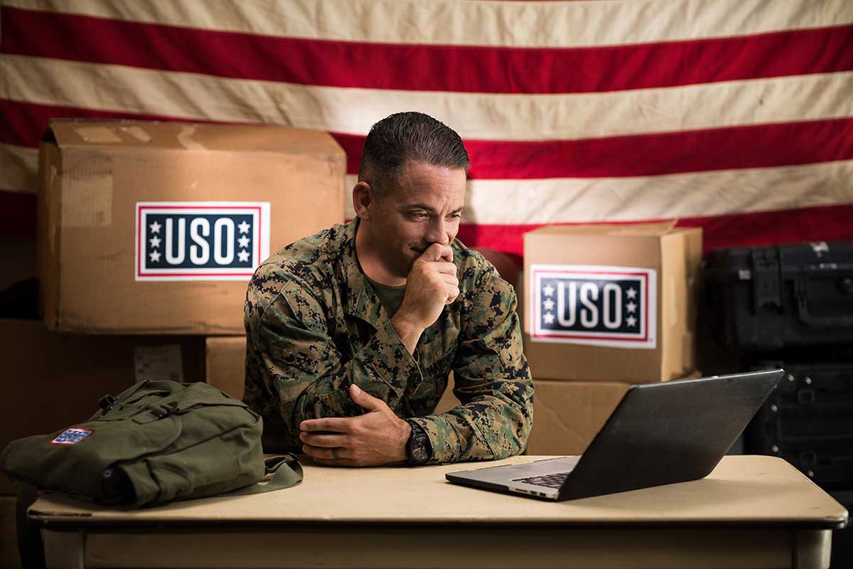 Service member connecting with his loved ones through a video call