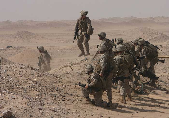 Service members in the desert