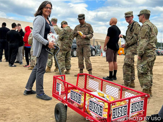 Service members in Poland receiving snacks from the USO