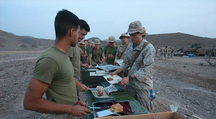 Service members enjoying a hot meal