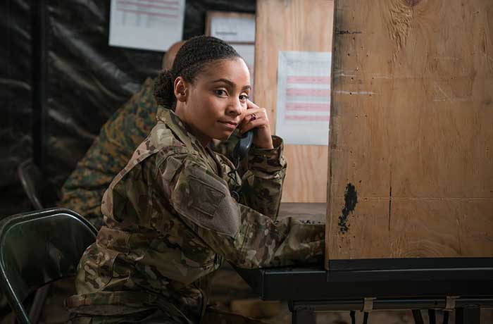 Service member on the phone at a USO facility