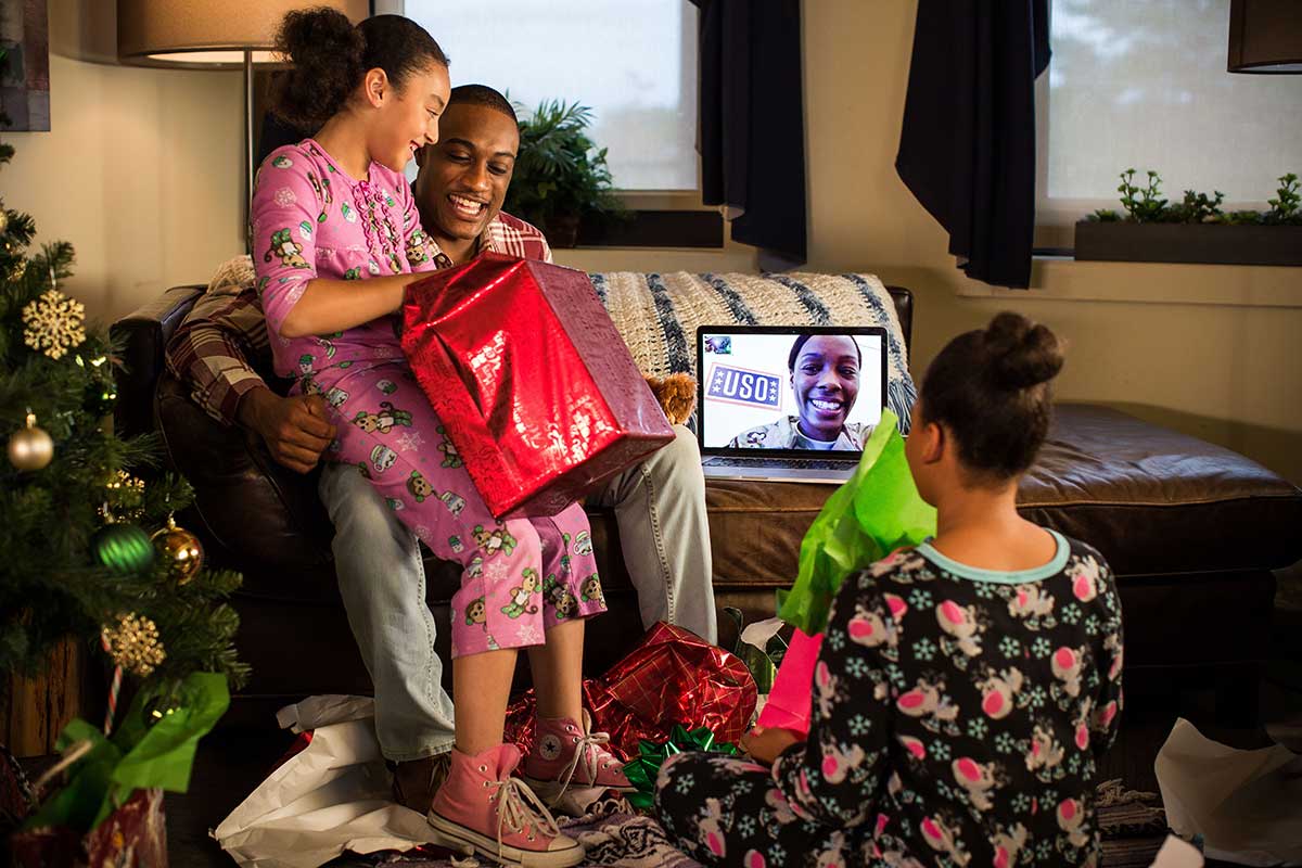 Service member and their family on a video call for the holidays