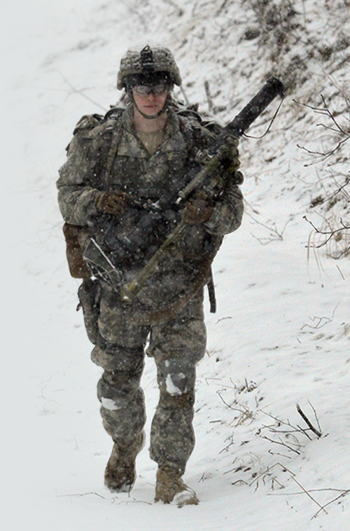 Service member walking in the snow